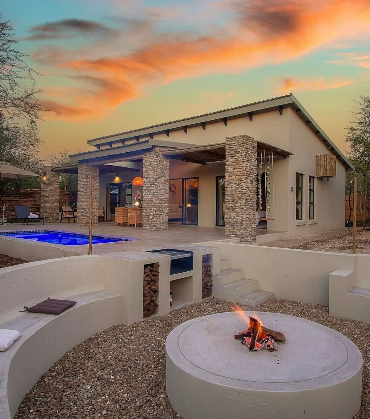 A Loko stay with a plunge pool and fire pit at sunset